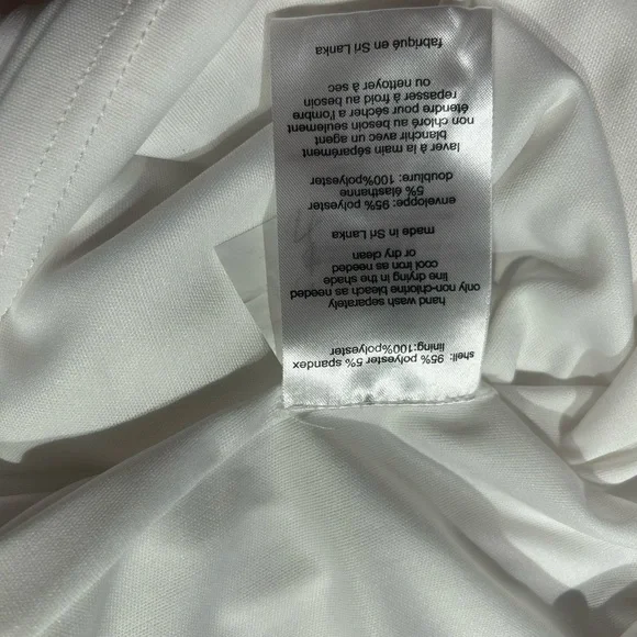 Long sleeve white jersey dress with side draping. NWT Size 12. - Picture 5 of 6